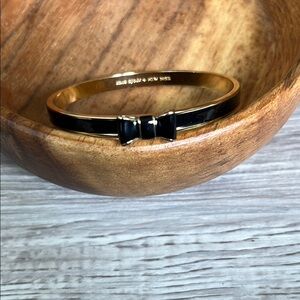 Kate Spade Elegant Black and Gold Bow Bracelet